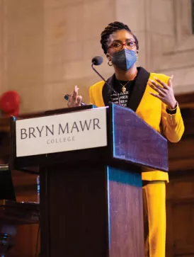 Shawna Murray-Browne speaking at a podium