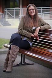 Portrait of Barb Toews on a bench