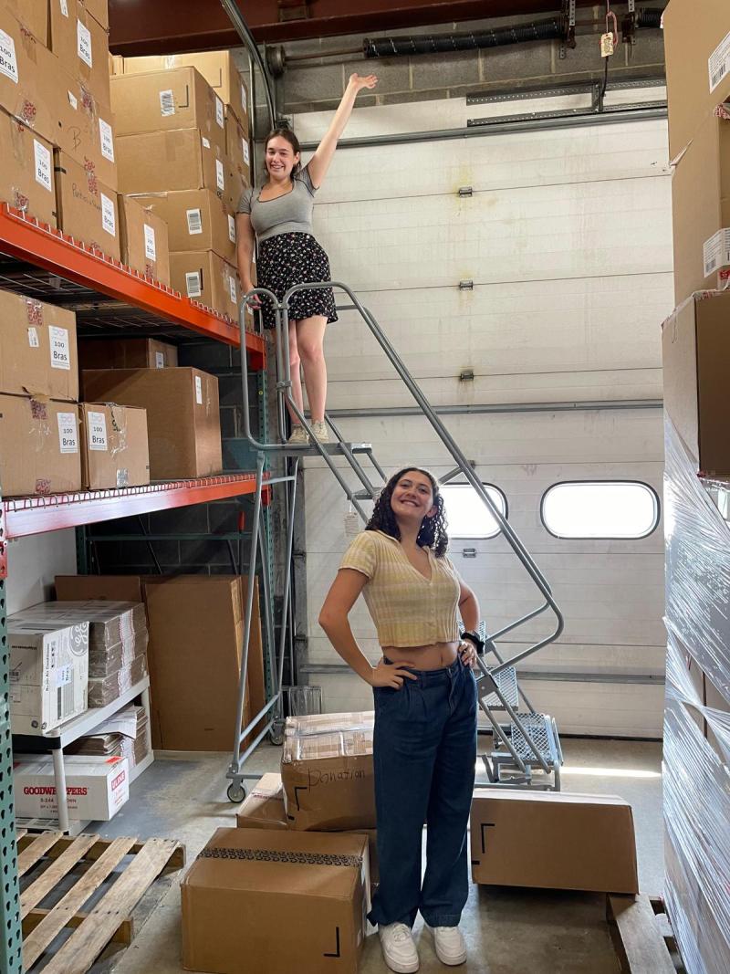 Katie standing in a warehouse. 