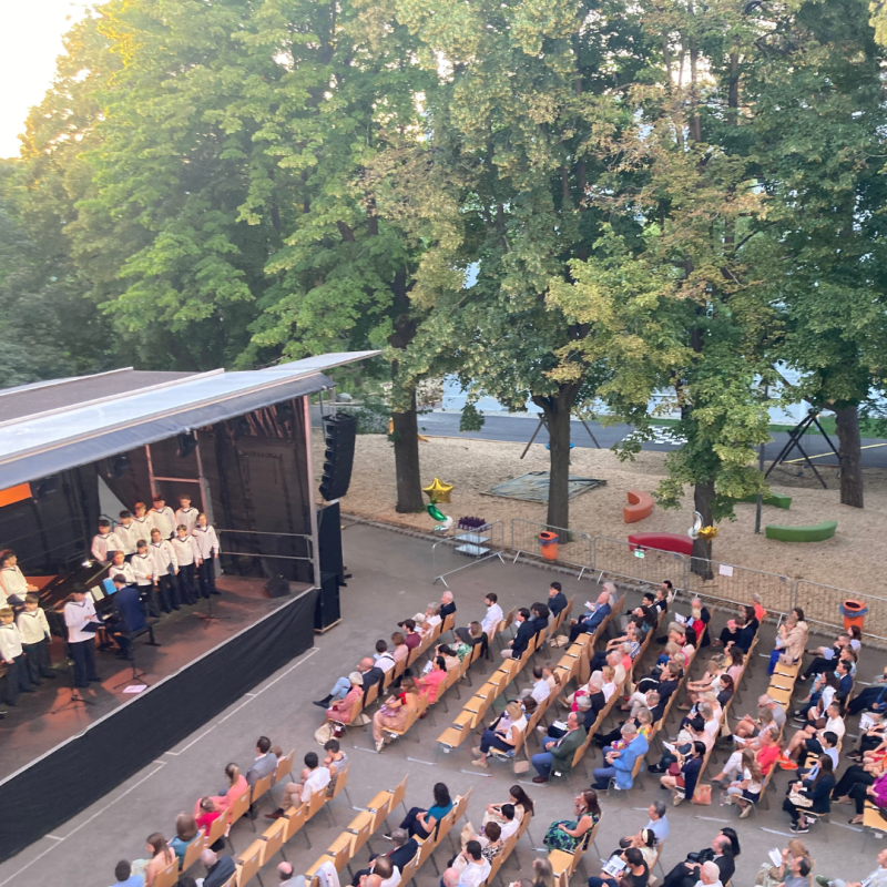 Audience seated at an outdoor music venue