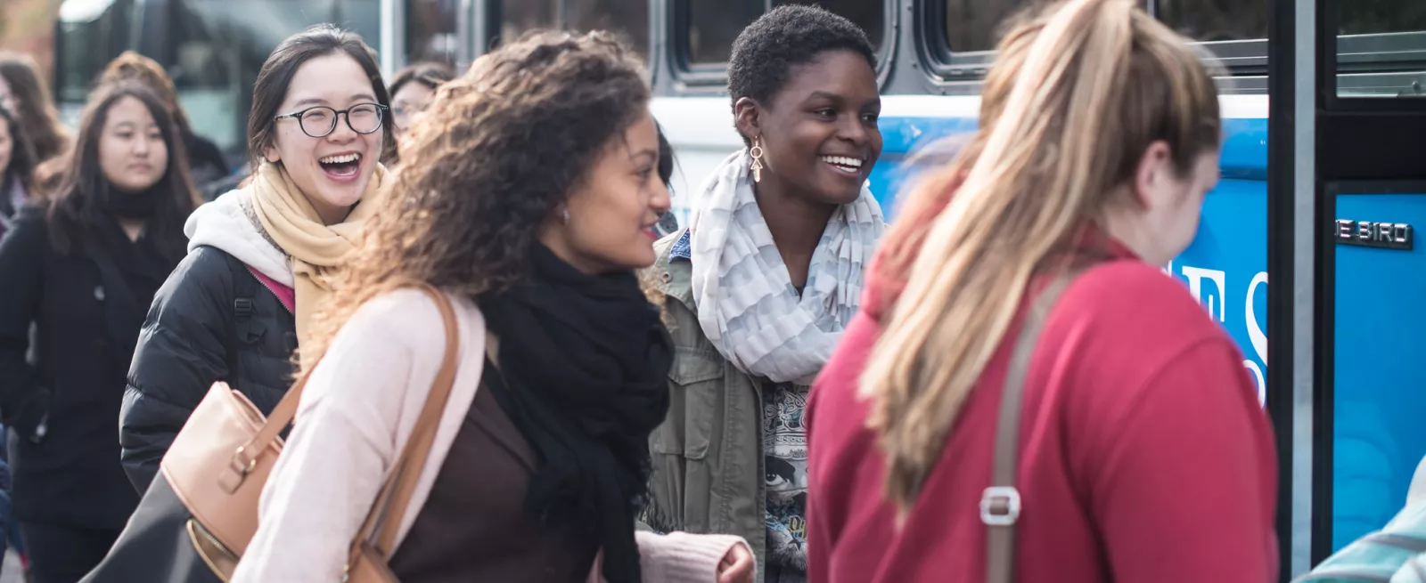 students on blue bus