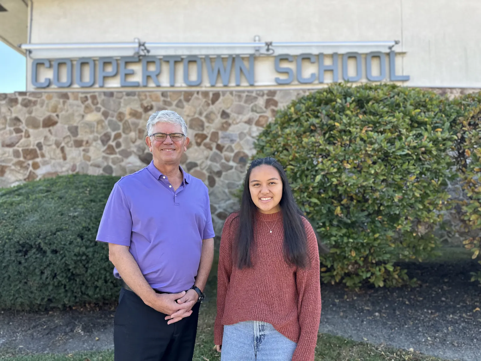 Victor Donnay and Kris Pasia outside of Coopertown Elementary