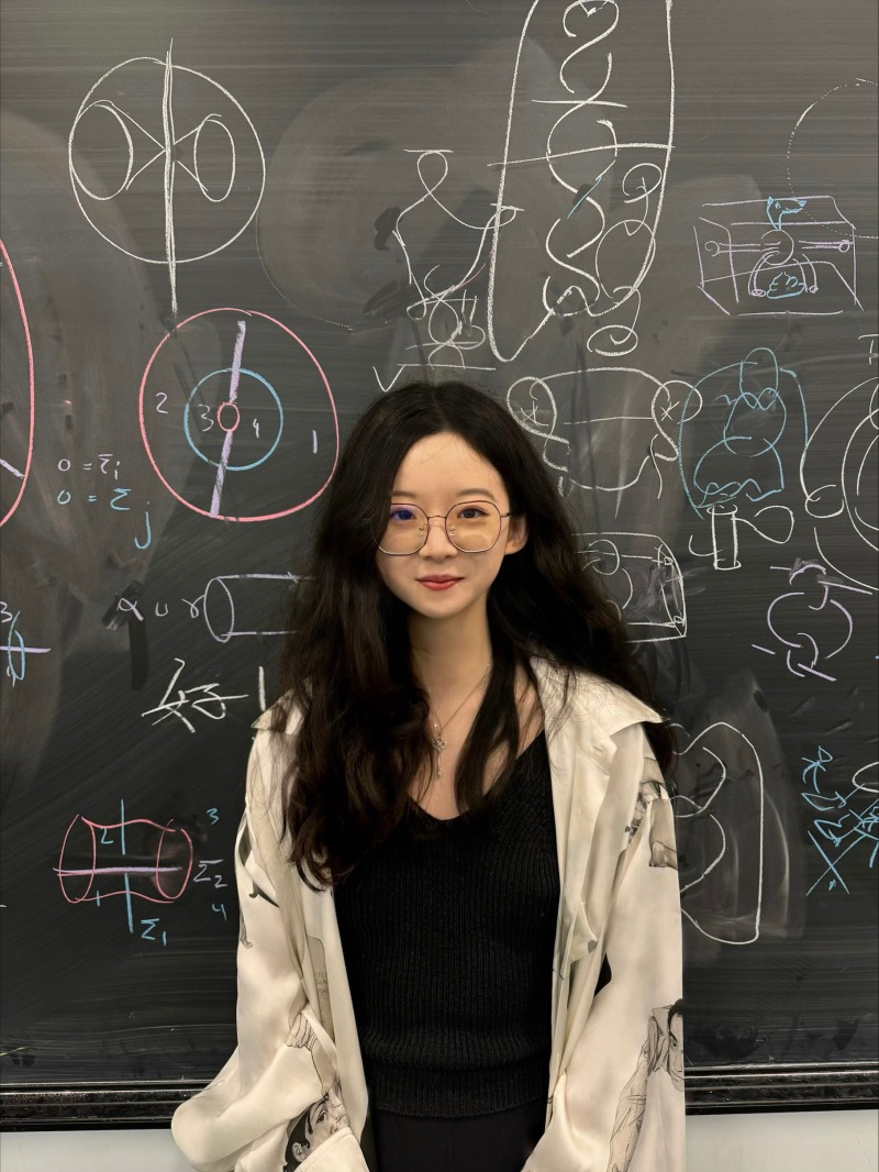 Ziwei Tan near chalkboard