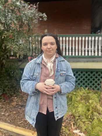 Academic Support - Aya - woman holding a to-go coffee cup